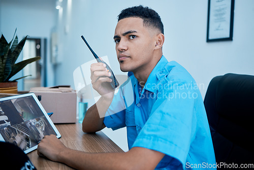 Image of Walkie talkie, security guard and man at table in communication, surveillance and thinking. Safety, protection and serious officer on radio at desk to chat on tech in police law enforcement service