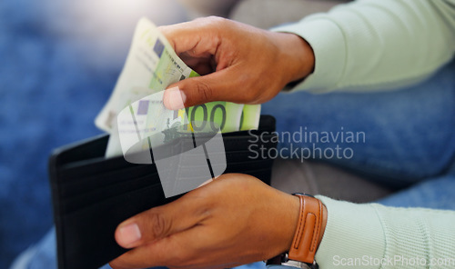 Image of Finance, cash and wallet with hands of man for payment, banking and investment in living room. Currency, bills and wealth with guy and counting euro money at home for purchase, shopping and income