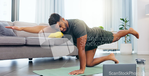 Image of Yoga, calm and a man doing meditation from a laptop for relaxation, exercise and mindfulness. Morning, fitness and a guy stretching while listening to calming music and following a tutorial on a pc