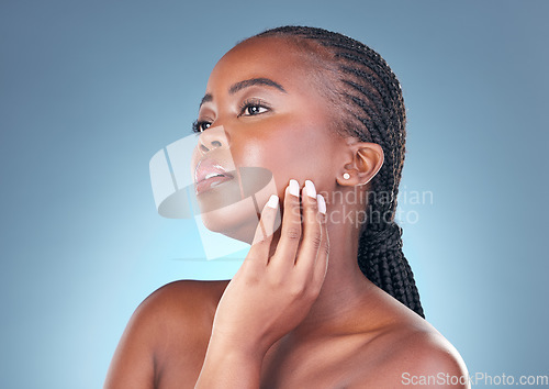 Image of Beauty, skin care and face of a black woman with dermatology, natural makeup and manicure. Headshot of African person on a grey background with cosmetics and facial glow with hand for soft touch