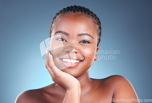 Image of Beauty, makeup and portrait of black woman on blue background for wellness, health and facial. Salon aesthetic, dermatology and face of African person in studio with cosmetics, skincare and glow