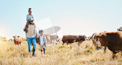 Image of Cattle farm, father and children or family outdoor for travel, sustainability and holiday. Black man and kids walking on a field for farmer adventure in countryside with cows and banner in Africa