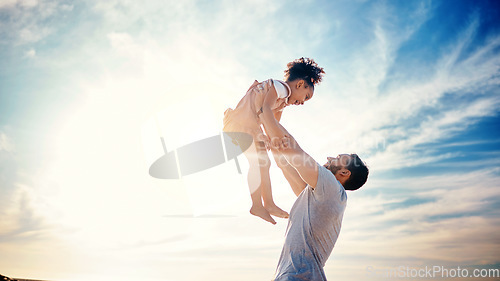 Image of Father lifting kid, air and blue sky with family, travel and freedom outdoor, bonding and ocean with girl and man. Happy people, sunshine and tropical vacation, child flying with dad and adventure