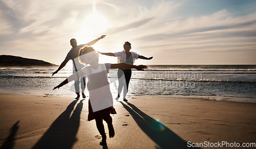 Image of Family, running and freedom on beach with sunset, shadow and fun together, games and bonding on vacation. Travel, adventure and playful, parents and child with happy people in nature and energy