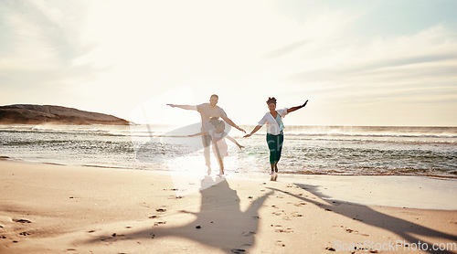 Image of Family, running and freedom on beach with sunshine, happiness and fun together, games and bonding on vacation. Travel, adventure and playful, parents and child, happy people in nature with energy