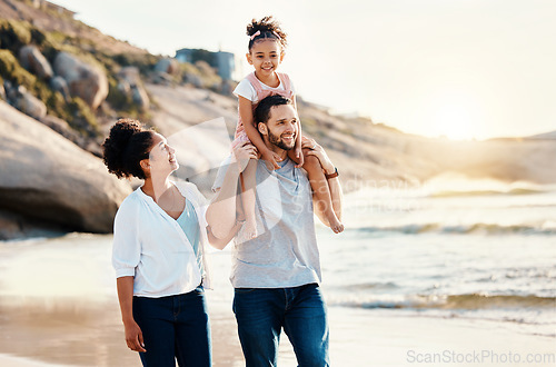 Image of Family on beach, kid on father shoulders and travel with bonding, love and walking together in nature. Vacation, ocean and happy people outdoor, parents and kid with sunshine and adventure with fun