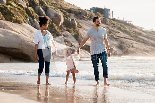 Image of Family, beach and holding hands, parents and child with travel and bonding, love and walking together outdoor. Vacation, ocean and happy people in nature, man and woman with kid, sun and adventure