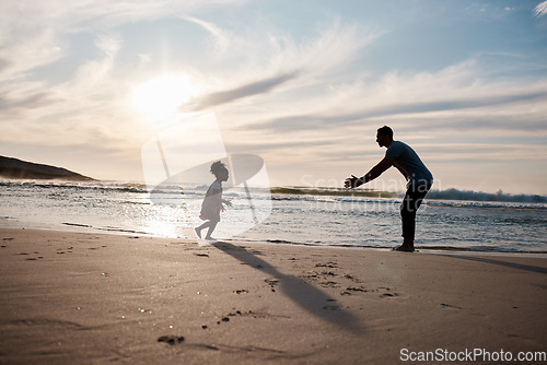 Image of Child run into father arms, beach and family with games, love and travel, freedom and fun together outdoor. Happy people, freedom and adventure, man and girl bond with tropical holiday and silhouette