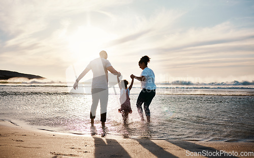 Image of Family play in ocean, beach and holding hands, parents and girl child with back view, fun in the sun and bonding outdoor. Happy people, freedom and adventure, splash in water and tropical holiday