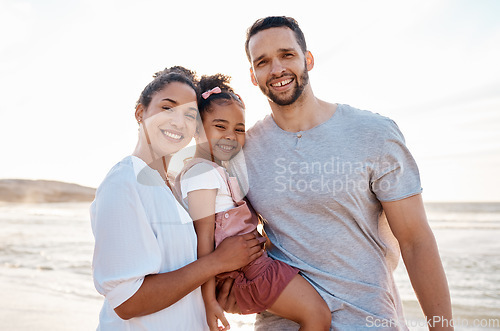 Image of Family, beach and portrait, parents and child with travel and bonding, love and happiness together outdoor. Vacation, ocean and happy people in nature, man and woman with kid, sunshine and adventure