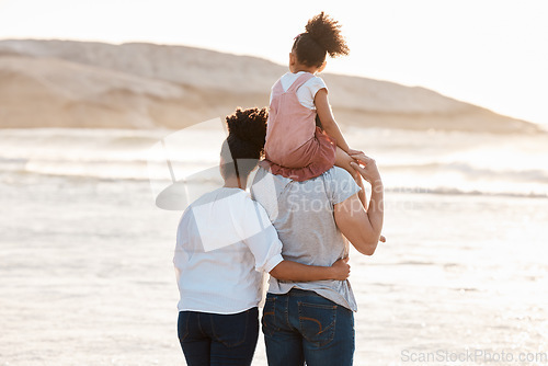 Image of Family, beach and watch sunset and ocean, travel and bonding, love with back view and together outdoor. Vacation, waves and people in nature, man and woman with kid, sunshine and adventure with peace