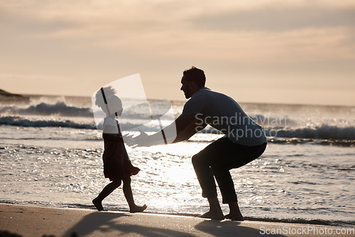 Image of Sunset, beach and silhouette of father with girl child in nature, bond and playing, freedom and enjoying summer vacation. Ocean, shadow and kid hug parent at sea with love, care and embrace in Bali
