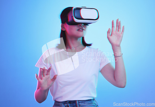 Image of Glasses, virtual reality and woman in futuristic metaverse, 3d games in education or digital e learning. Young person or student in VR, high technology or vision with neon and blue, studio background