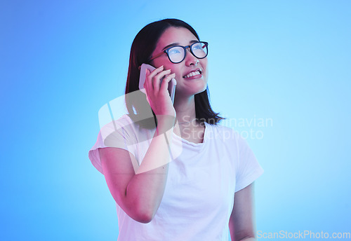 Image of Phone call, thinking an Asian woman in conversation using mobile app to contact person online for talking or discussion. Connection, cellphone and young female speaking with smile for communication