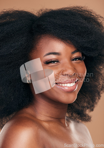 Image of Portrait, hair care and black woman with beauty, shine and wellness on brown studio background. Growth, person or African model with texture, afro or cosmetics with aesthetic, face or smile with glow