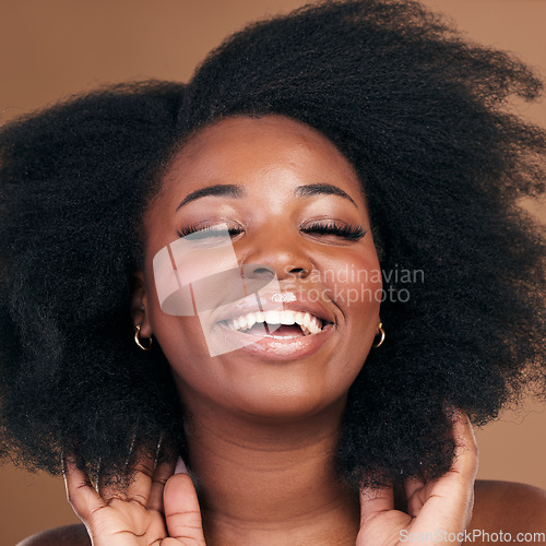 Image of Beauty, black woman and hair care for afro, smile or volume on a brown studio background. Growth, hairstyle or African model with cosmetics after salon treatment, wellness or funny with natural shine