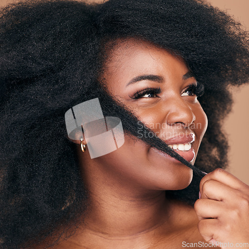 Image of Beauty, hair and happy with a model black woman in studio on a brown background for natural cosmetics. Face, smile and haircare with a confident young afro female person indoor for keratin treatment