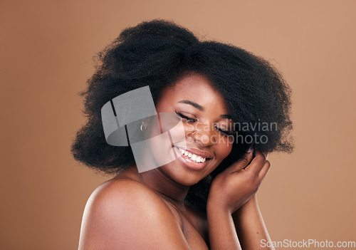 Image of Natural, black woman and hair care with beauty, smile and luxury on a brown studio background. Afro, hairstyle and African model with mockup space, aesthetic and shine with salon treatment and growth