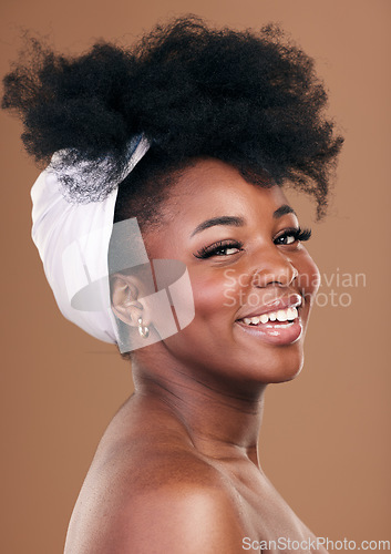 Image of Hair, smile and beauty portrait of a model black woman in studio on a brown background for natural cosmetics. Face, happy and haircare with a young afro female person indoor for shampoo treatment