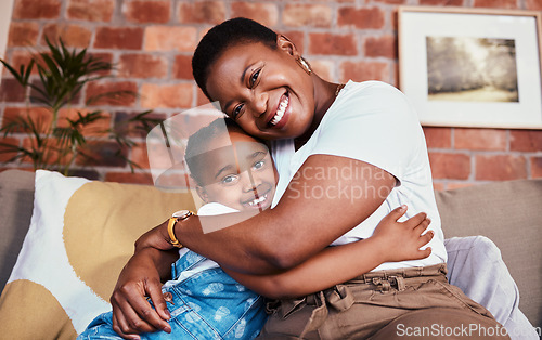 Image of Portrait, mother and daughter on sofa with hug, smile and relax bonding in living room together. Love, mom and girl child on couch in house, happy embrace and support, trust and black woman with kid