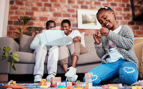 Image of Playing, smile and a child with building blocks and parents on the sofa with a laptop in a house. Happy, black family and a girl kid with toys on the lounge floor for education, learning and a game