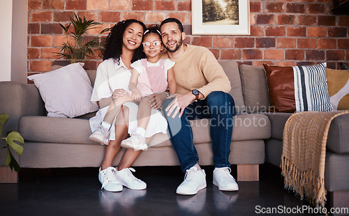 Image of Portrait of happy family in living room, parents and child on sofa with love, bonding and relax in home. Mom, dad and girl kid on couch in apartment with smile, man and woman with daughter together.