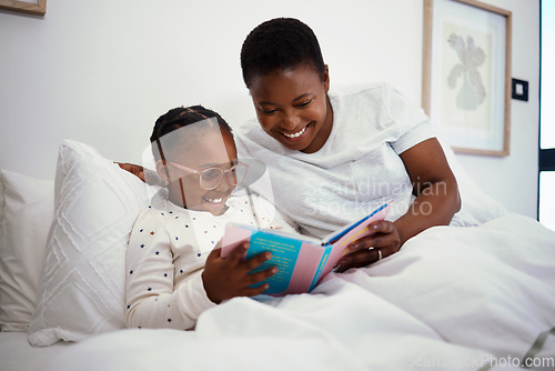 Image of Relax, storytelling and book with mother and daughter in bedroom for education, fantasy and bedtime. Happy, learning and reading with woman and child in bed of black family home for knowledge