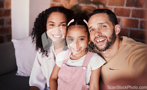 Image of Selfie of family in living room, parents and child with love, smile and relax on sofa in home. Portrait of mom, dad and girl on couch in apartment, happy man and woman with daughter bonding together.