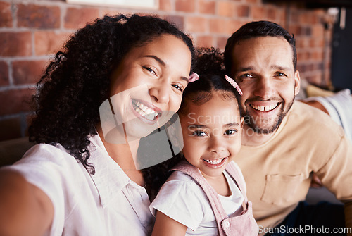 Image of Selfie of mom, dad and child on sofa with love, bonding and relax in living room in apartment. Portrait of father, mother and daughter on couch in home with smile, happy man and woman with girl kid.
