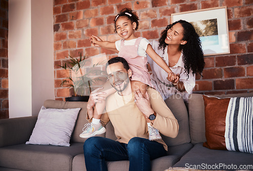 Image of Family, happy and portrait while playing on a home sofa for fun, bonding and time together. A man, woman and girl kid in a lounge with love, care and happiness for airplane game in Puerto Rico house