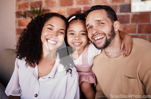 Image of Family, happy and portrait with a hug on a home sofa for fun, bonding and time together. A man, woman or parents and girl kid in a lounge with love, care and happiness in a house in Puerto Rico