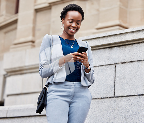 Image of Business, city or black woman with a smartphone, typing or connection with consultant, smile or communication. Person, entrepreneur or cellphone with mobile app, email or outdoor with internet search