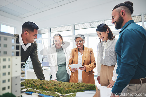 Image of Creative people, real estate and designers in meeting with 3D model, building project or startup at office. Happy engineering team in architecture brainstorming, strategy or design idea at workplace