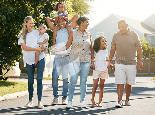 Image of Big family, outdoor and walking in neighbourhood together for fun, bonding or activity with kids, parents and grandparents. Summer, time and happy people relax with children on vacation or holiday