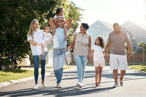 Image of Outdoor, big family and walking in neighbourhood street together for fun, bonding or activity with kids, parents and grandparents. Happy, time and relax in urban summer with children on vacation