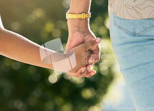 Image of Holding hands, mother and daughter in closeup, outdoor and walking together with care, love or bonding, Mom, young kid and summer sunshine in garden, backyard or park for family, vacation and freedom