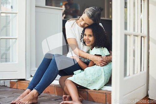 Image of Adoption, mom and child together for hug, support or love in family home of girl in foster care with a smile of happiness. Interracial, mother and daughter bonding in embrace or playing outdoor