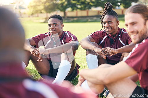 Image of Sports, rugby and men on grass for rest at training, practice and exercise workout for match. Fitness, teamwork and male people relax for planning strategy for competition, challenge or game on field