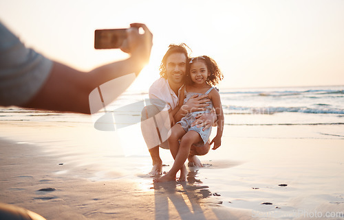 Image of Phone photography, father and daughter at beach, sunset sky and happy for memory, holiday and bonding. Smartphone, profile picture and man with girl child, hug and care for post, social media and sea