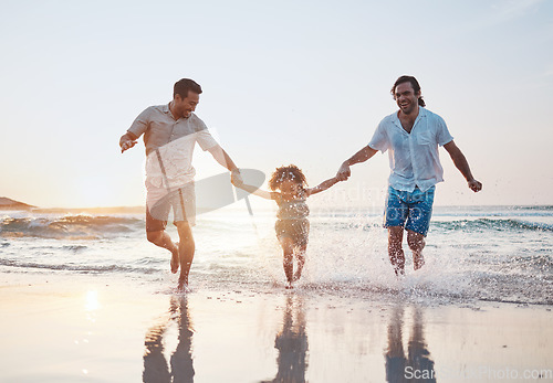 Image of Holding hands, beach and gay couple with a child, happy or vacation with celebration, quality time or bonding. Queer people, men or kid with sun flare, seaside holiday or family with love or lgbtq