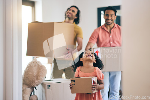 Image of Happy, family and box moving with child and gay parents in new home with cardboard package. Smile, kid and lgbt people together with real estate and property mortgage in a house helping father