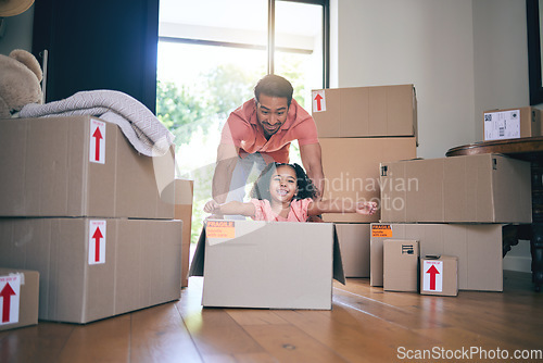 Image of Father, child and box in new home for games, fun and freedom for bonding in real estate property. Happy dad, excited kid and portrait of girl play in cardboard boxes for race while moving to house