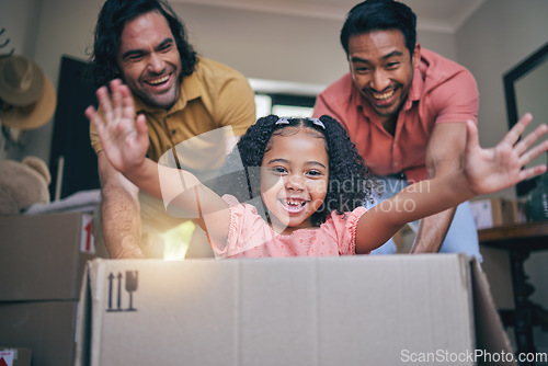 Image of Family home, girl and box with dad, push and gay parents with games, portrait and excited on floor with moving. LGBTQ men, female child and cardboard package for car, airplane and speed in new house