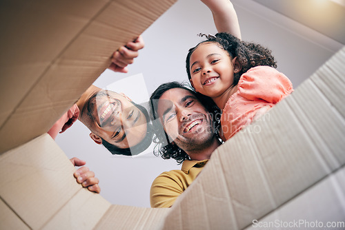 Image of Family, open box and moving from below, portrait and smile in new house with gay father, girl kid and excited. LGBTQ men, cardboard package and happy with female child for start, life and property
