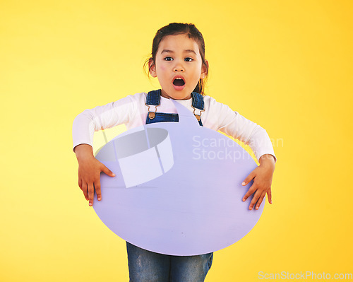 Image of Girl child, thinking and speech bubble in studio with wow, news and mockup space by yellow background. Young female kid, poster or shock for promotion, review and opinion with vote for social media