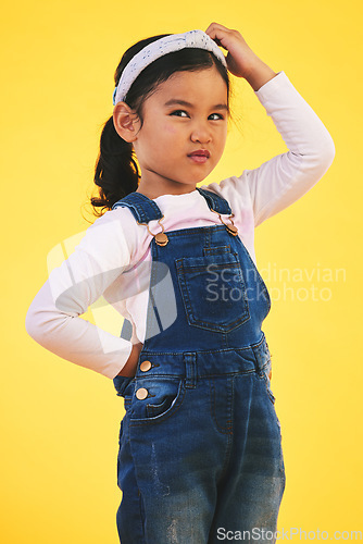 Image of Confused, doubt and kid thinking in studio isolated on yellow background. Question, idea or girl child trying to remember memory, solution or choice, decision or why, brainstorming or problem solving