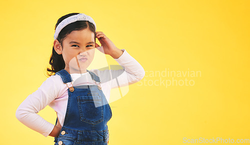 Image of Confused, doubt and portrait of kid thinking in studio isolated on a yellow background mockup space. Question, idea face and girl child trying to remember memory, solution or choice, decision or why