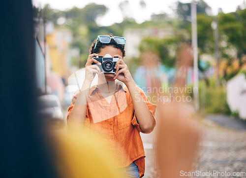 Image of Photography, friends and women in city for travel on holiday, adventure and vacation on weekend. Camera, peace sign and female people take picture for social media, memories and bonding in town