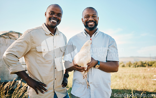 Image of Portrait, chicken and a happy farmer team in the agriculture industry for sustainability or free range farming, Smile, poultry farm and a black man with his partner on a agricultural field in summer