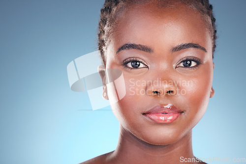 Image of Black woman, beauty and portrait with cosmetics, makeup and dermatology treatment. Studio, model face and African female person with skincare, facial and blue background with skin glow and care